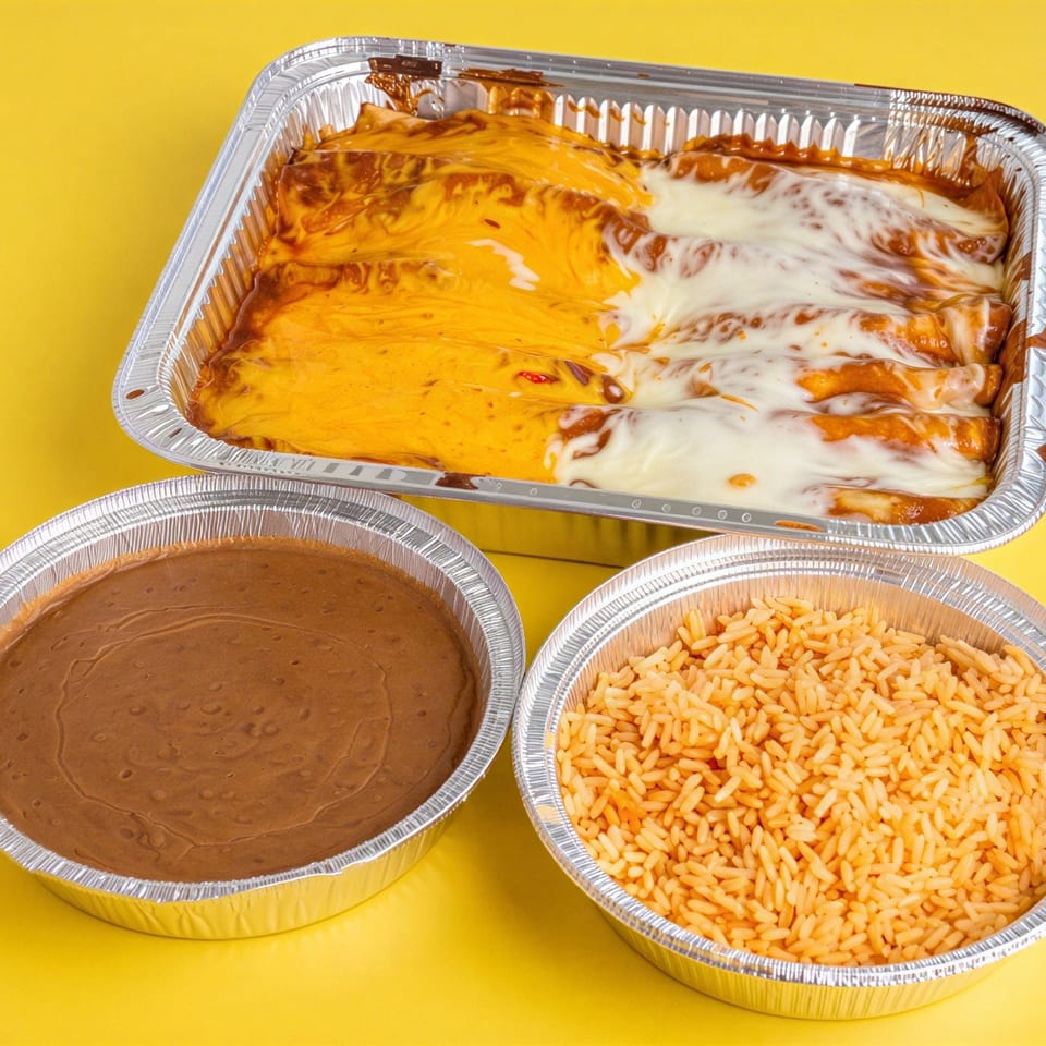 Aluminum trays of cheesy enchiladas, refried beans, and orange rice arranged on a bright yellow background.